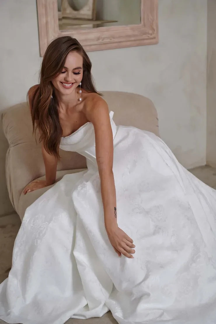 Elegant A-Line Draped Strapless Corset White Floor-Length Wedding Gown