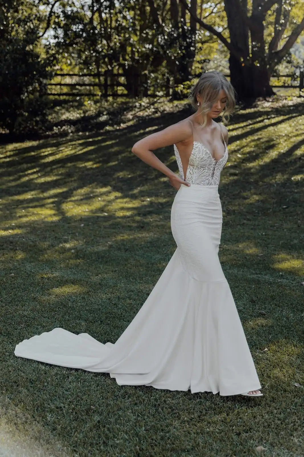 Elegant Illusion Mermaid Deep V-Neck Sleeveless Backless Ivory Chapel Wedding Gown