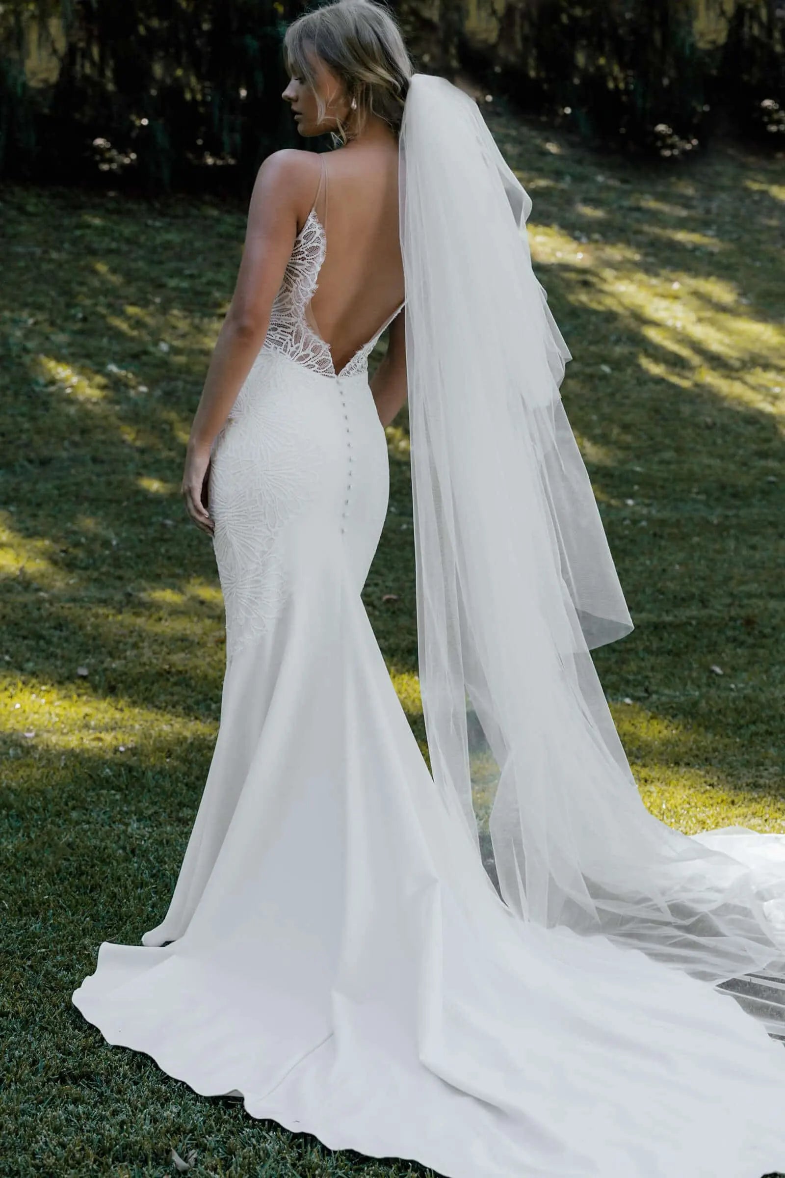 Elegant Illusion Mermaid Deep V-Neck Sleeveless Backless Ivory Chapel Wedding Gown