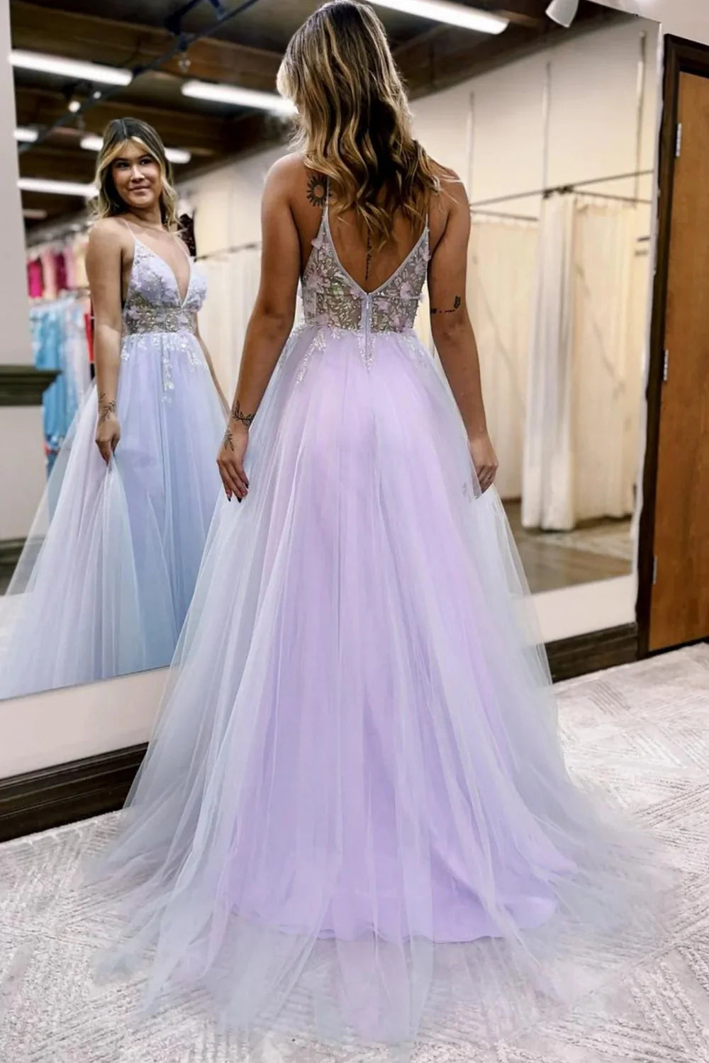 Back view of the light blue A-line prom dress, showcasing the flowing tulle skirt.