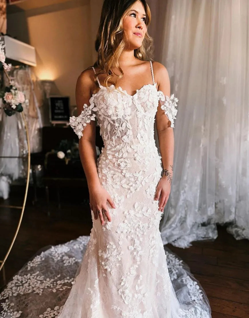 Close-up of the delicate 3D appliques on a mermaid wedding dress.