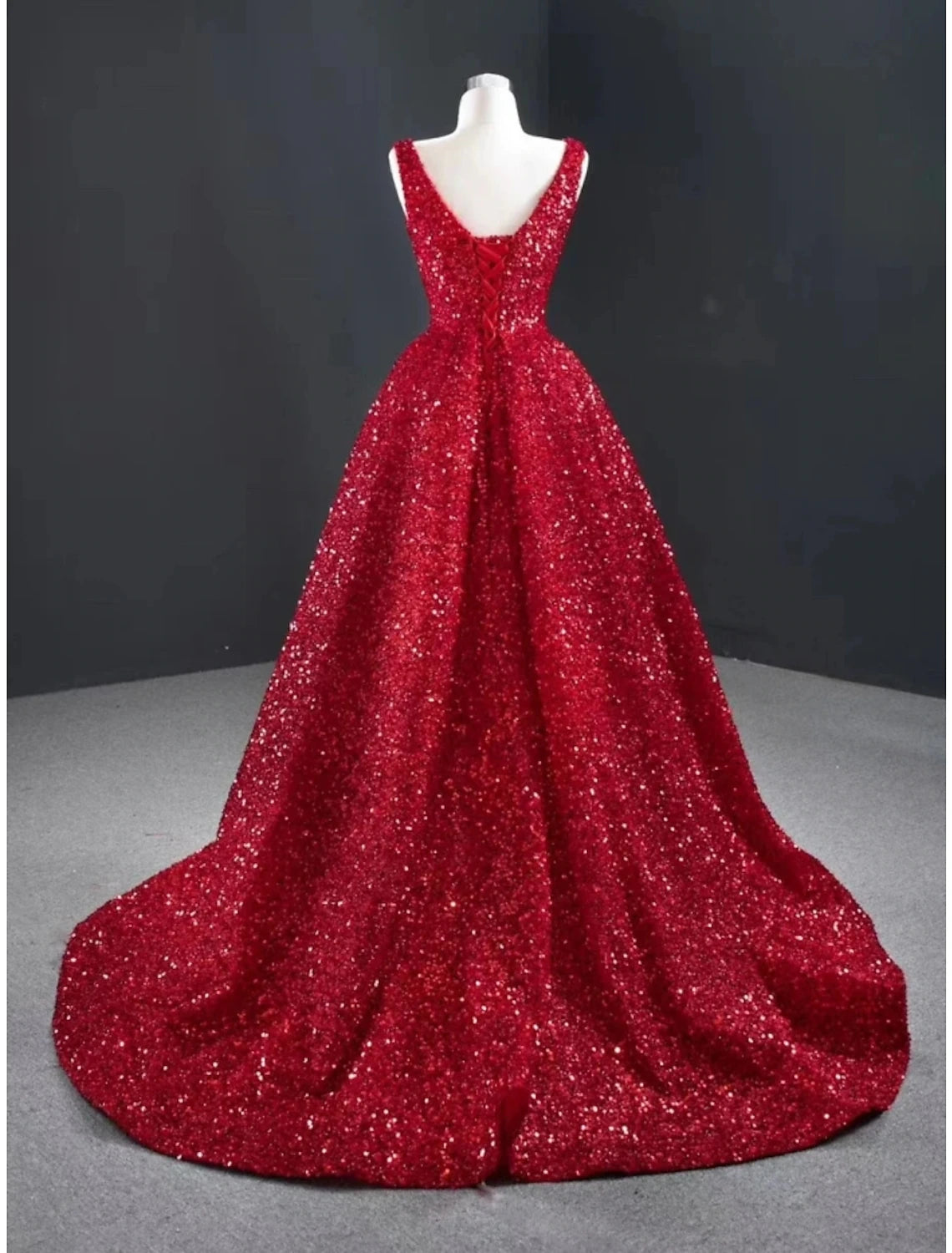 Dazzling A-line V-neck sequined green evening gown with a sweep train.