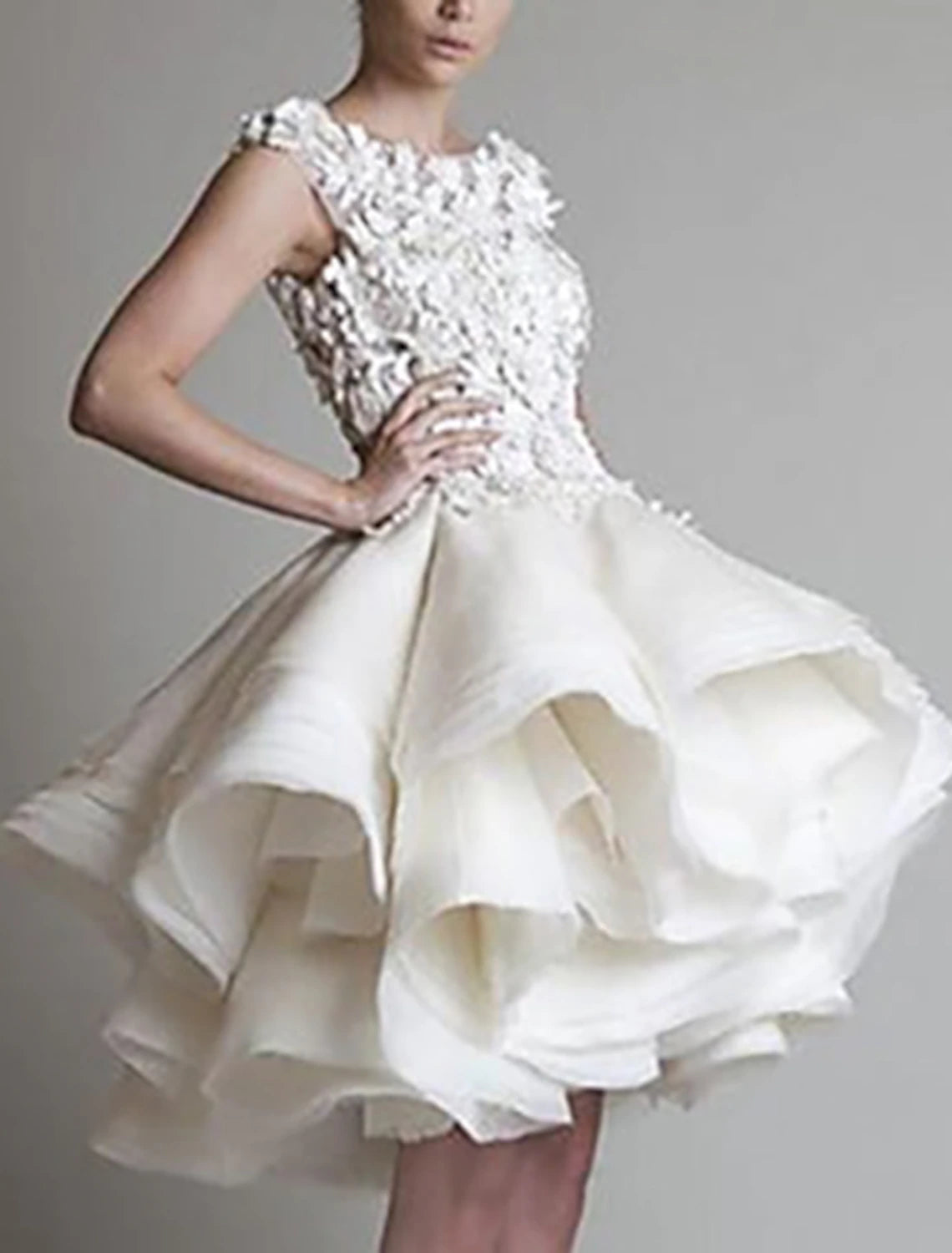 Side view of white short party dress with appliques.