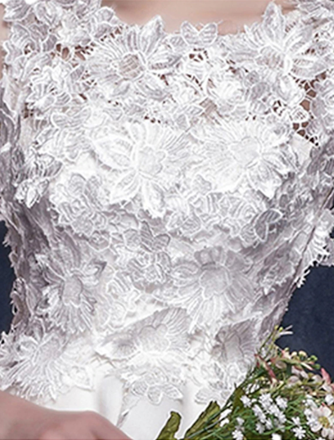 White mini dress with shoulder flower detail.