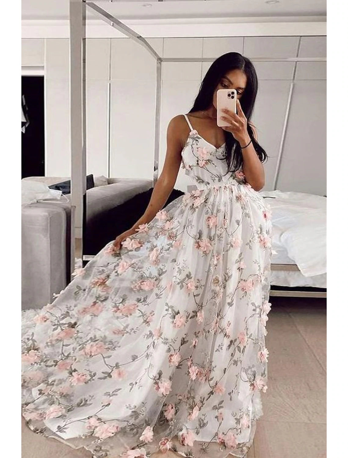 Model wearing a floral lace sheath prom dress with spaghetti straps and sweep train.