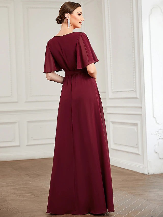 Back view of a floor-length A-line bridesmaid dress with subtle draping.