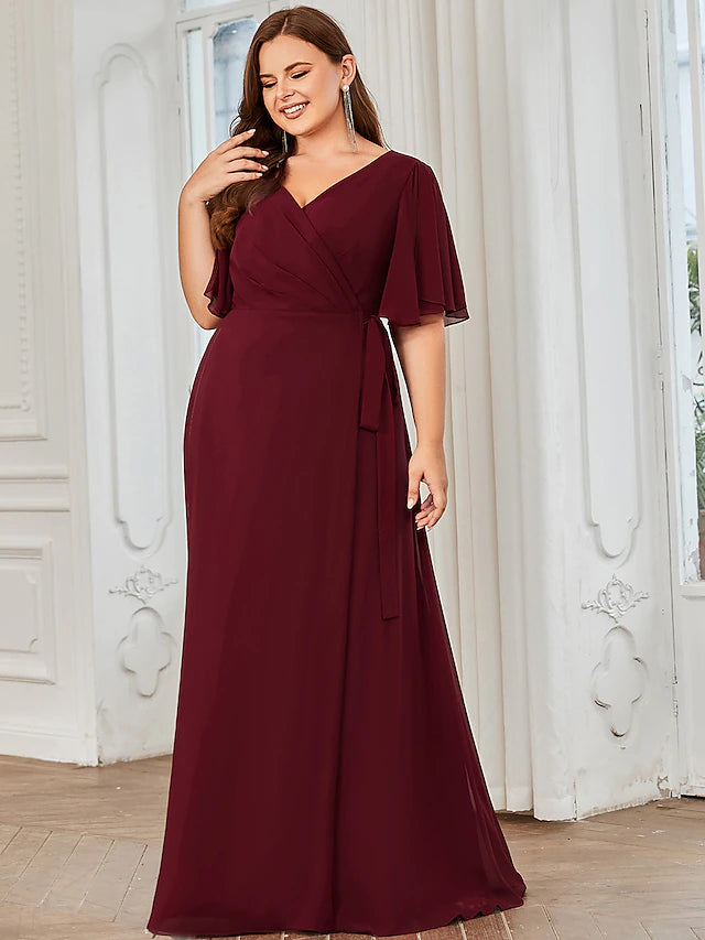 Close-up of the V-neckline and short ruffled sleeves on a bridesmaid dress.