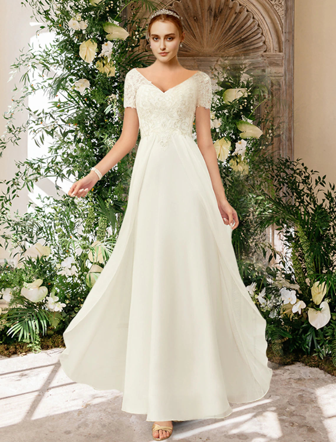 Elegant A-Line V-neck short sleeve chiffon beach wedding dress with pleats and appliques.