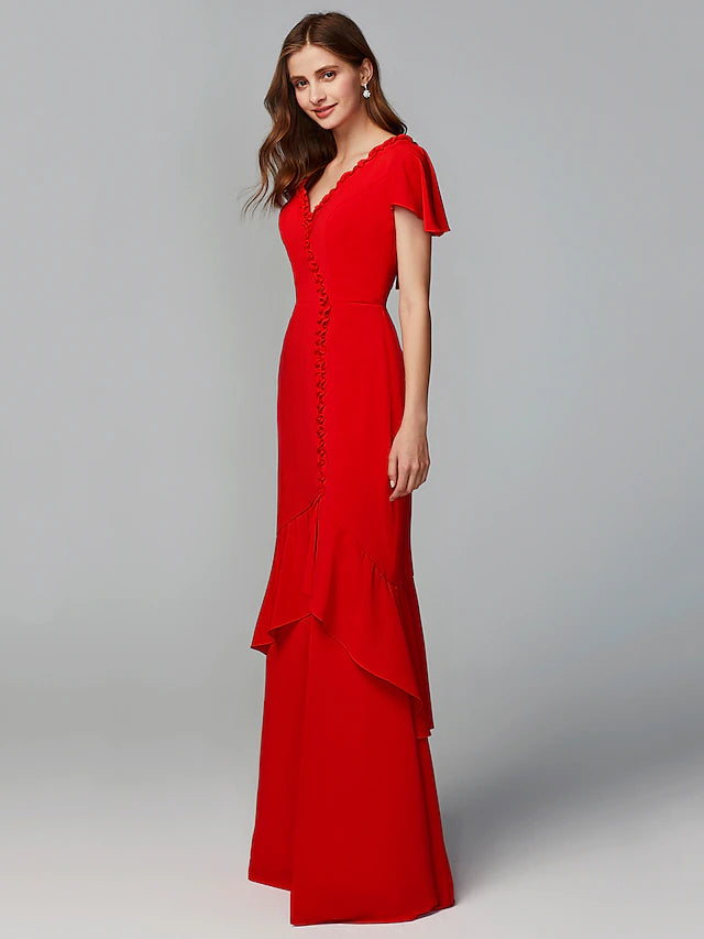 Close-up of the V-neckline and short sleeve detail on the chiffon dress.