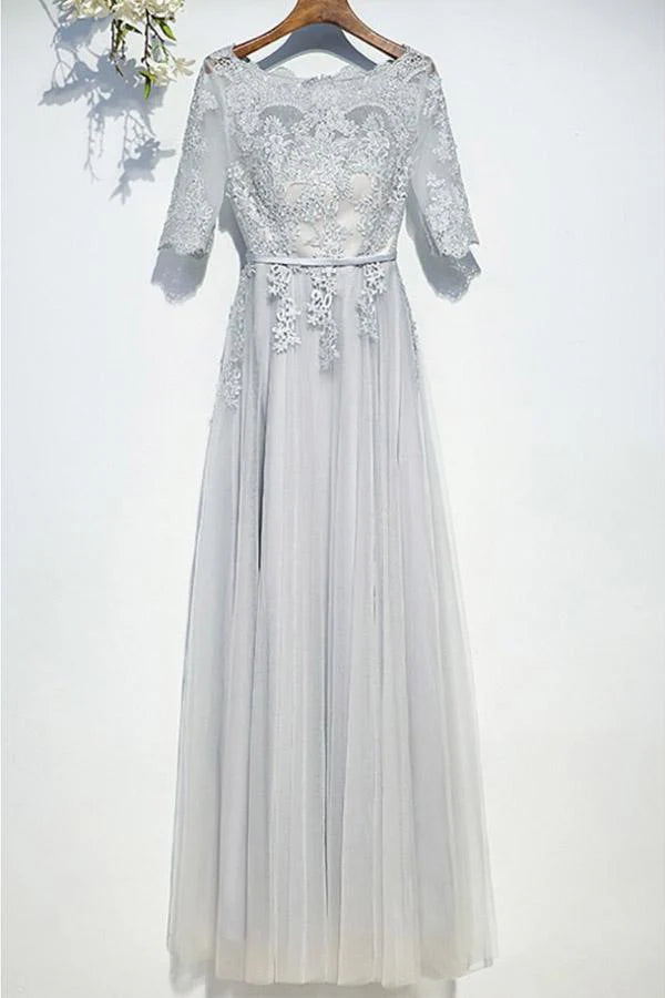 Elegant tulle A-line prom dress with short puffy sleeves, front view on a model.