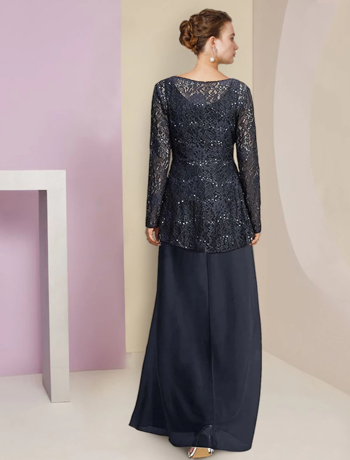 Elegant chiffon lace A-Line dress featuring ruched details and a flowing tea length skirt.