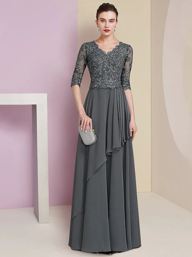 Woman wearing an A-line V-neck half sleeve lace beaded floor-length Mother of the Bride dress.