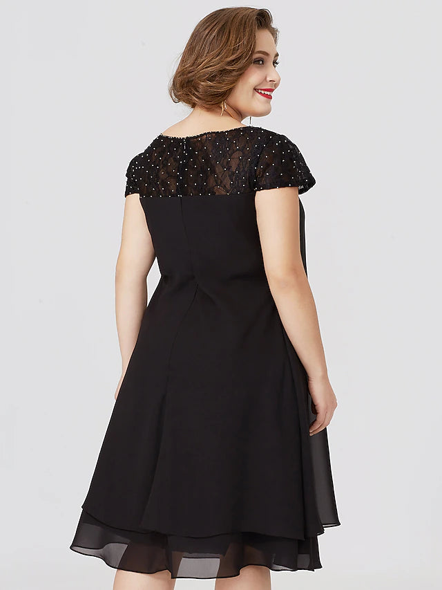 Another angle of the elegant black formal dress, suitable for special occasions.