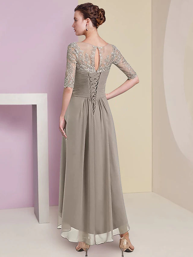 Detail of the V-neckline and half sleeves on the two-piece formal gown.