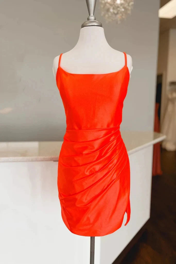 Fuchsia ruched bodycon satin mini dress with spaghetti straps.