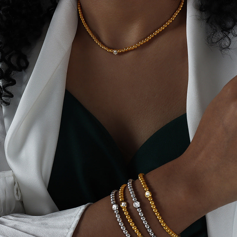 Geometric zircon two-piece bracelet and necklace set.