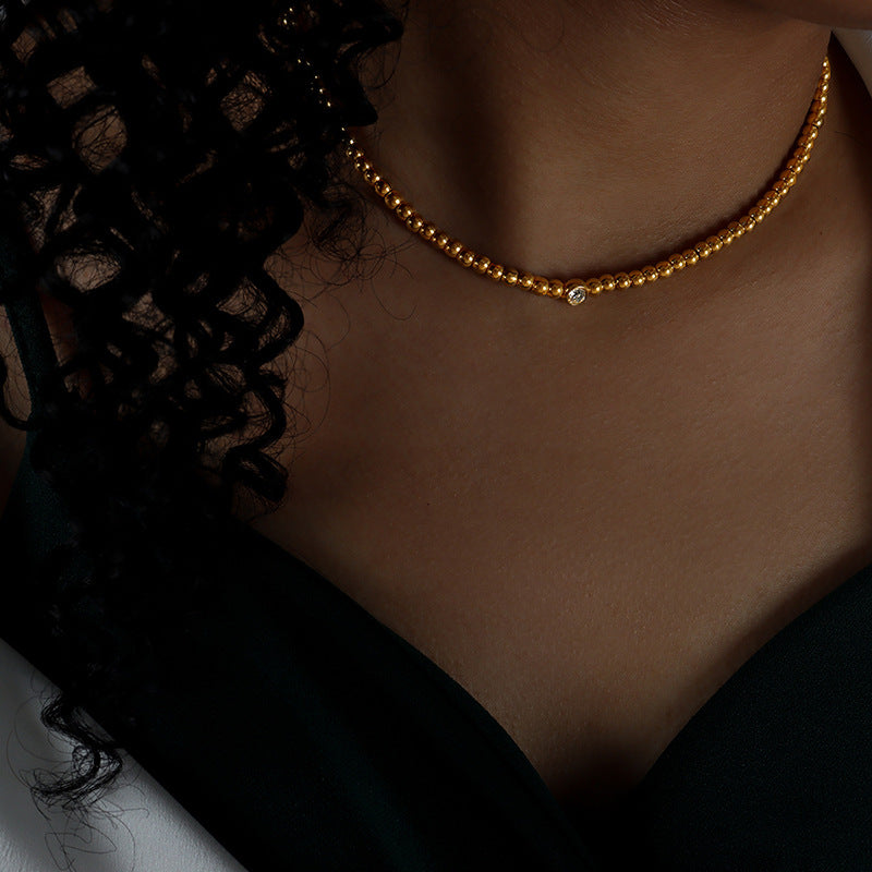 Close-up of the geometric round beaded bracelet with mosaic zircon.
