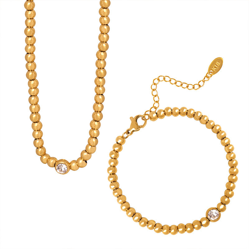 Elegant geometric jewelry set featuring a bracelet and necklace.