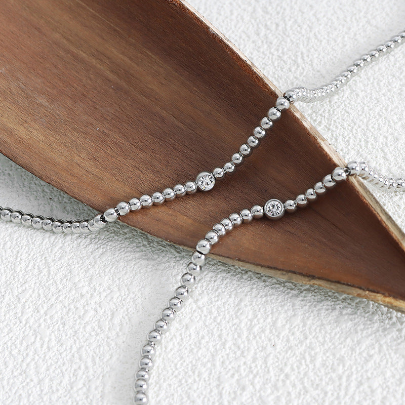 The personalized necklace from the geometric beaded jewelry set.