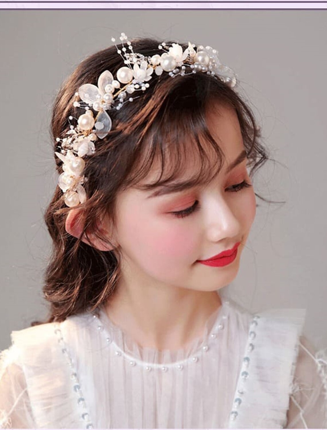 Close-up of the white floral garland headband.