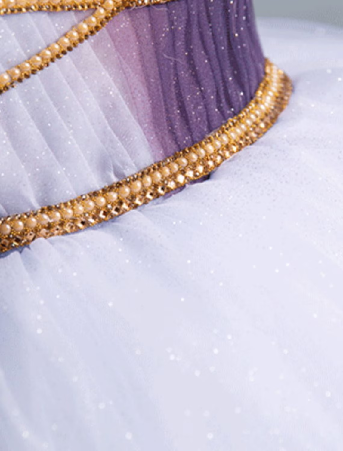 Full length view of a girl in a purple princess party dress.