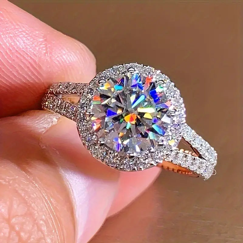 Moissanite crown ring elegantly displayed on a hand.
