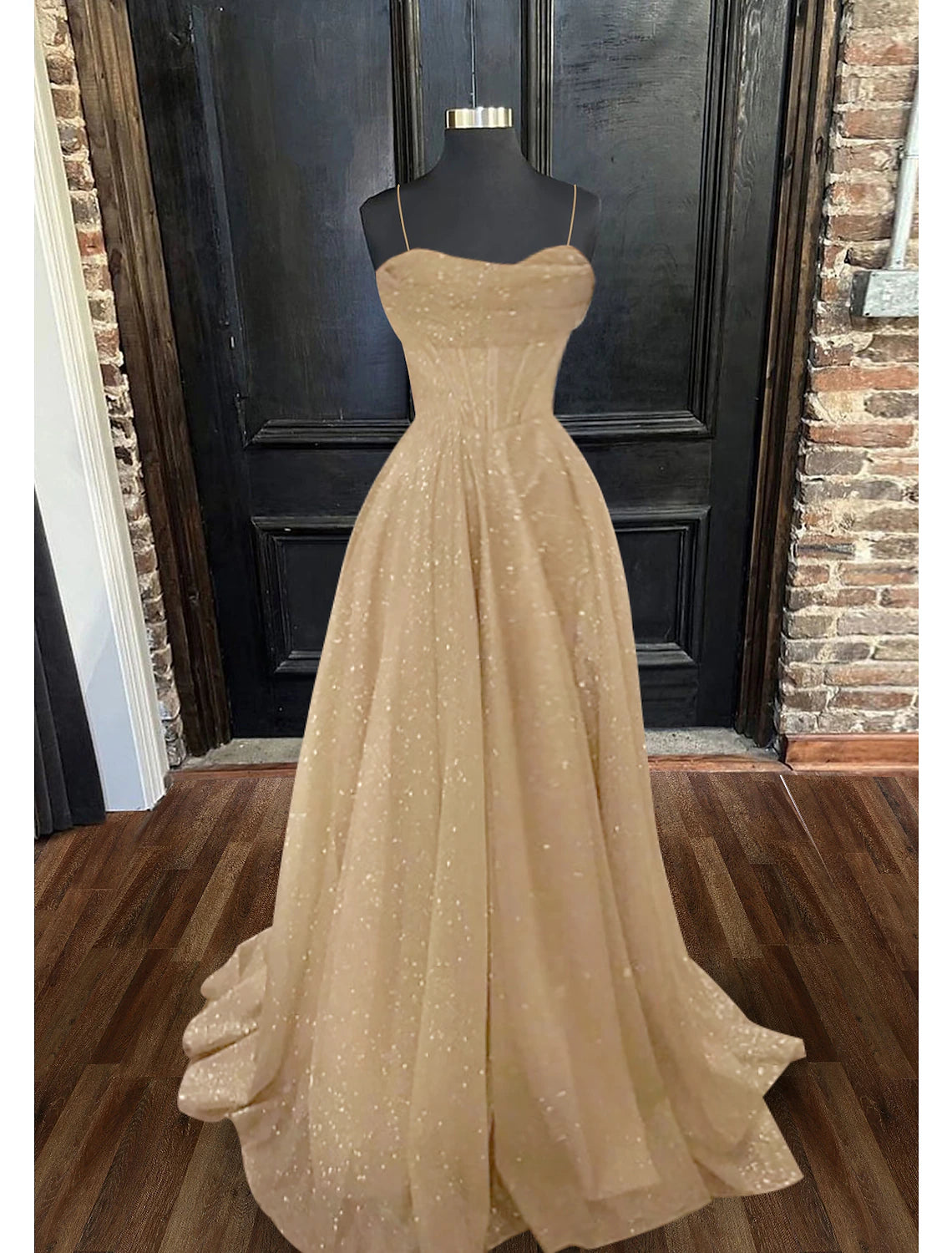 A-Line prom dress with spaghetti straps, corset bodice, glitter tulle, and a sweep train.