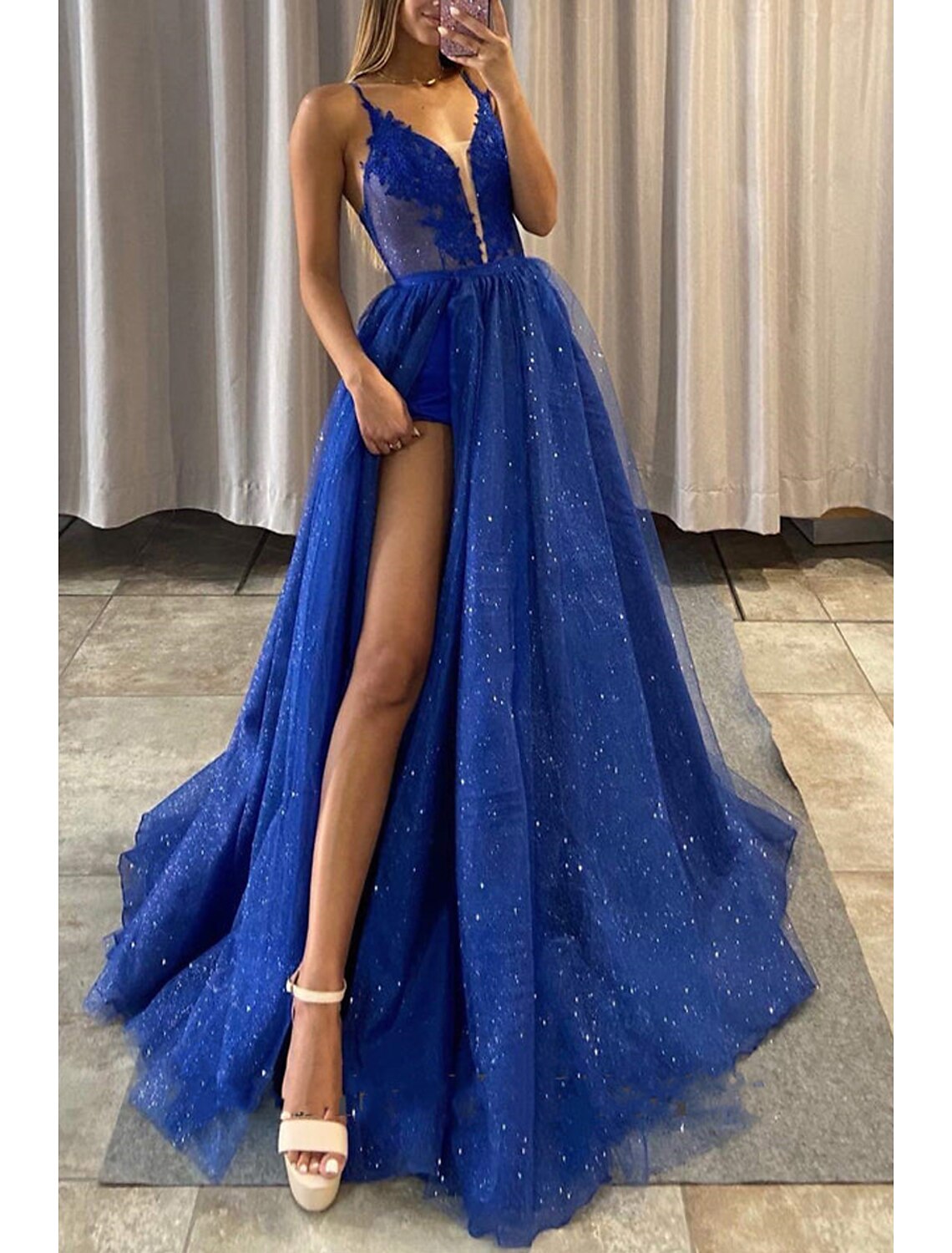 Back view of the A-Line V-neck prom dress showcasing the sweep train and appliques.