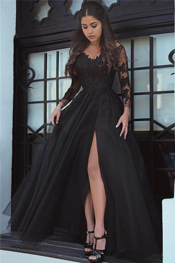 Model wearing a glamorous black lace long-sleeve A-line prom dress with a V-neck and high slit.