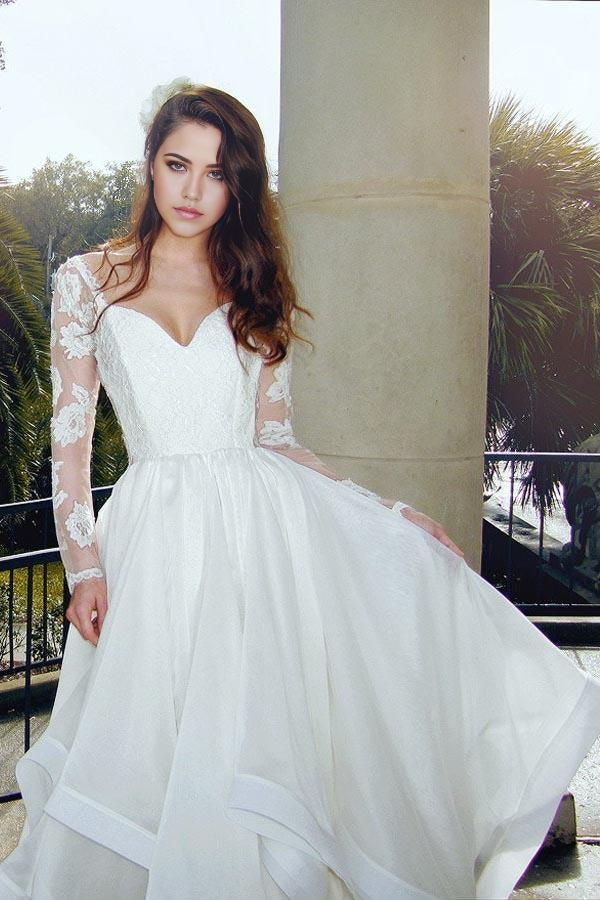 Full view of the glamorous A-line V-neck long sleeve lace organza wedding dress.