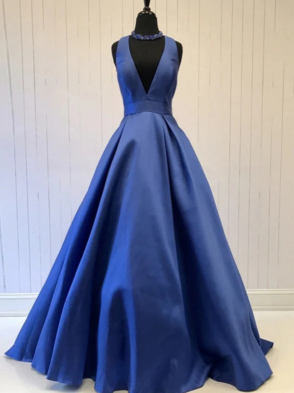 Woman wearing a long deep V-neck satin prom dress.