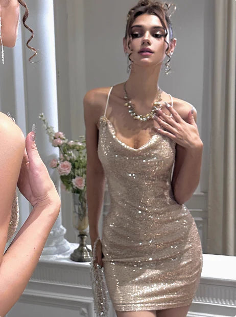 Full view of the gold sequin homecoming dress, featuring a draped cowl neckline and bodycon fit.