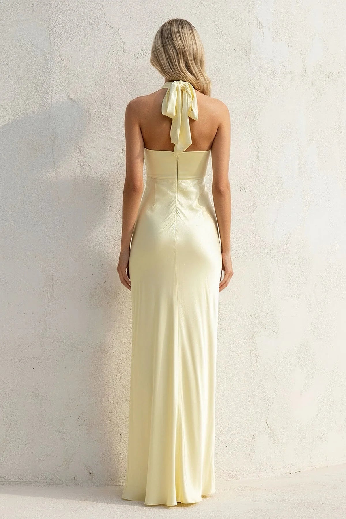 Back view of the satin mermaid gown showcasing the tied bow.