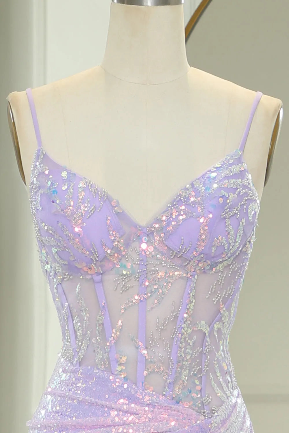 Backless light purple mermaid prom dress with corset detailing.