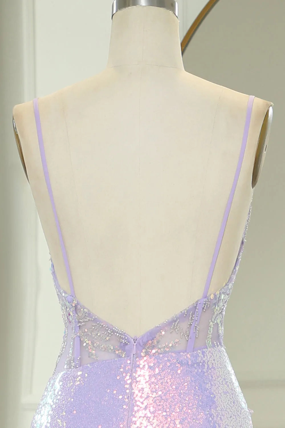 Side view of light purple mermaid prom dress showing high slit.
