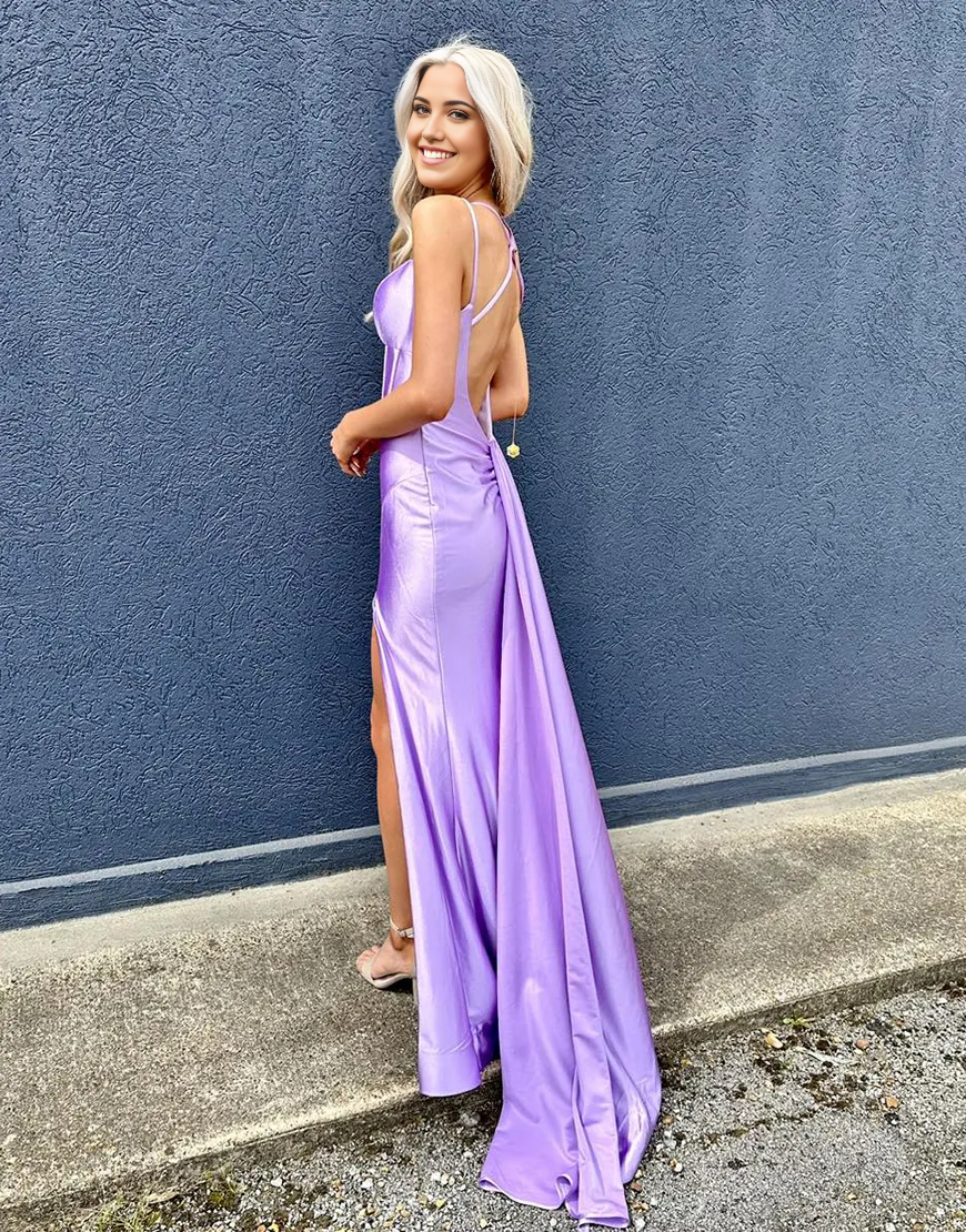 Back view of a purple mermaid satin dress with corset lacing.