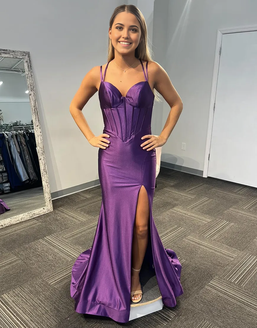 Side profile of purple mermaid satin dress, highlighting the high slit.