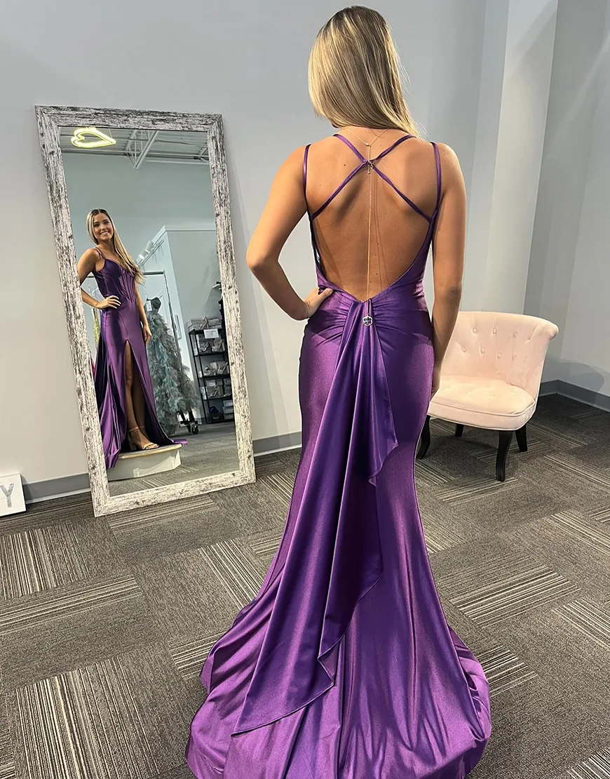 Full length view of a model wearing a purple mermaid satin dress.