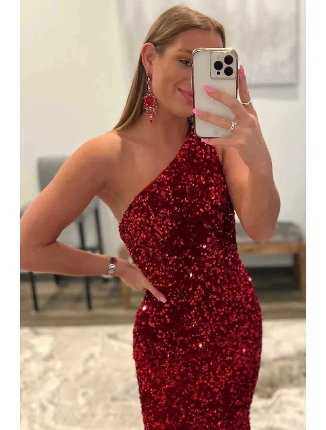 Close-up of the sequin detail on a glamorous one-shoulder mermaid prom dress.