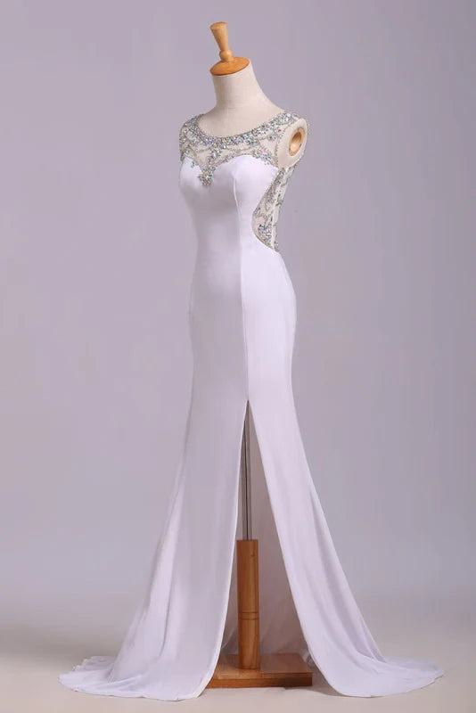 Side view of a mermaid prom dress with a high slit and sequin embellishments.