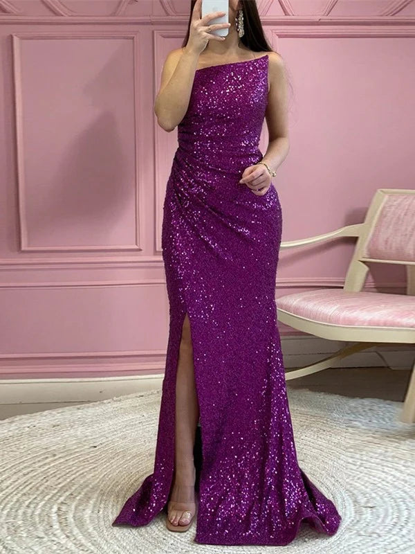 Side profile of a woman in the shimmering mermaid sequin prom gown.