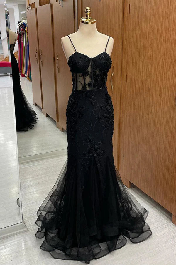 Elegant mermaid prom dress with sweetheart neckline and intricate appliques.