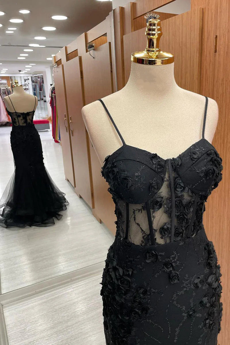 Side view of a glamorous mermaid gown with flowing tulle and appliques.