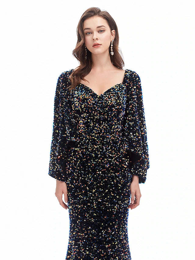 Full length view of the elegant sequined long sleeve evening gown.