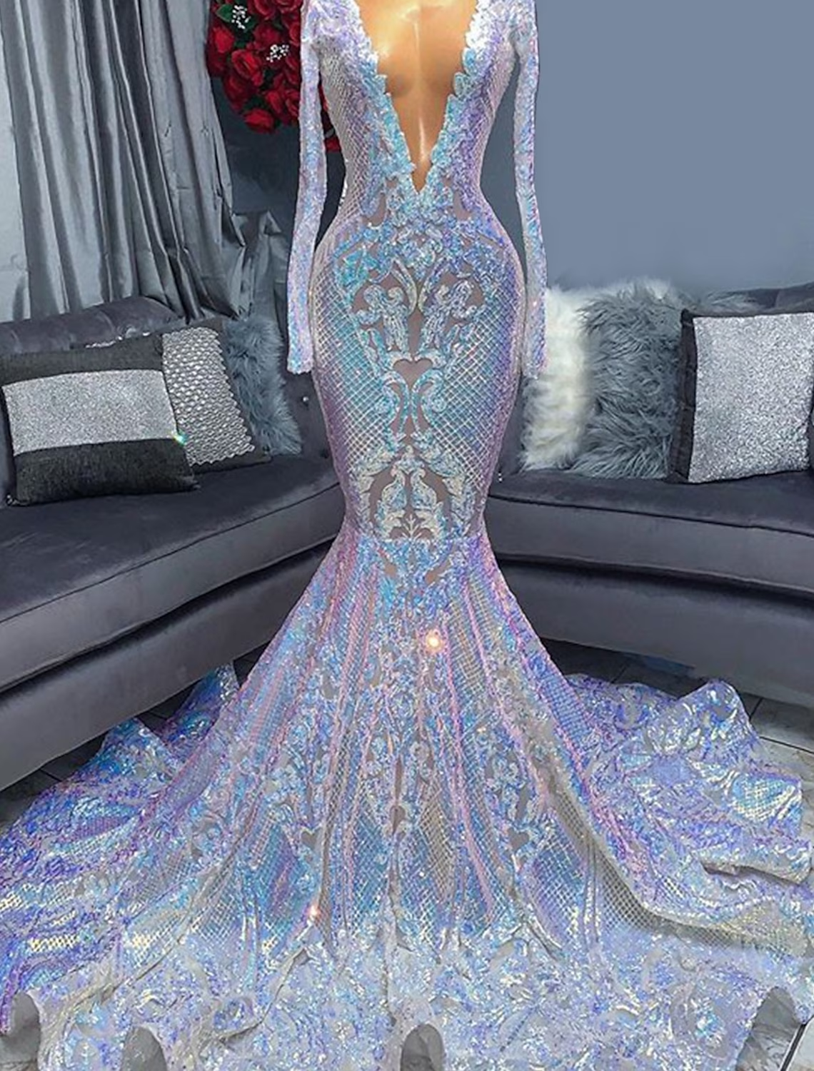 Side view of the sequined mermaid trumpet evening gown, highlighting the chapel train.