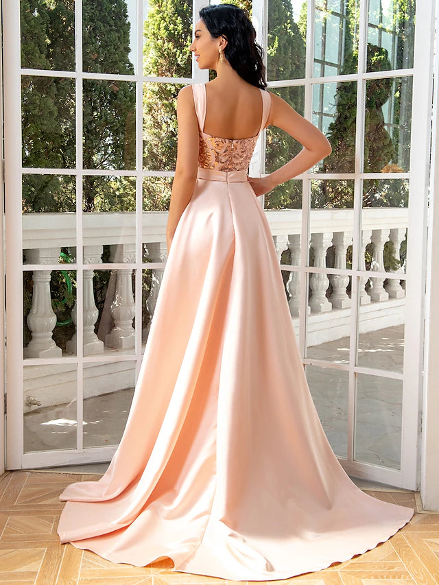 Full-length view of a woman in a dark mermaid trumpet evening dress, suitable for formal events.