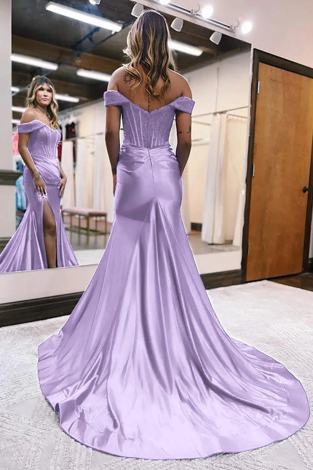 Back view of a model in a lilac off-shoulder mermaid dress.