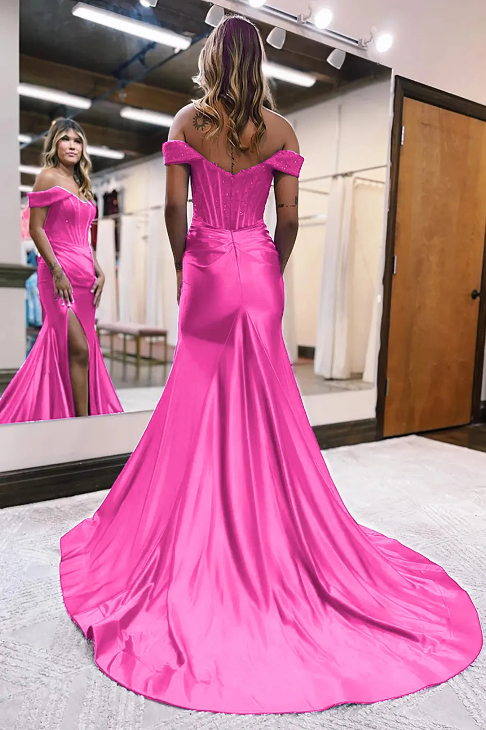 Close-up of the fuchsia off-shoulder mermaid gown's bodice and split detail.
