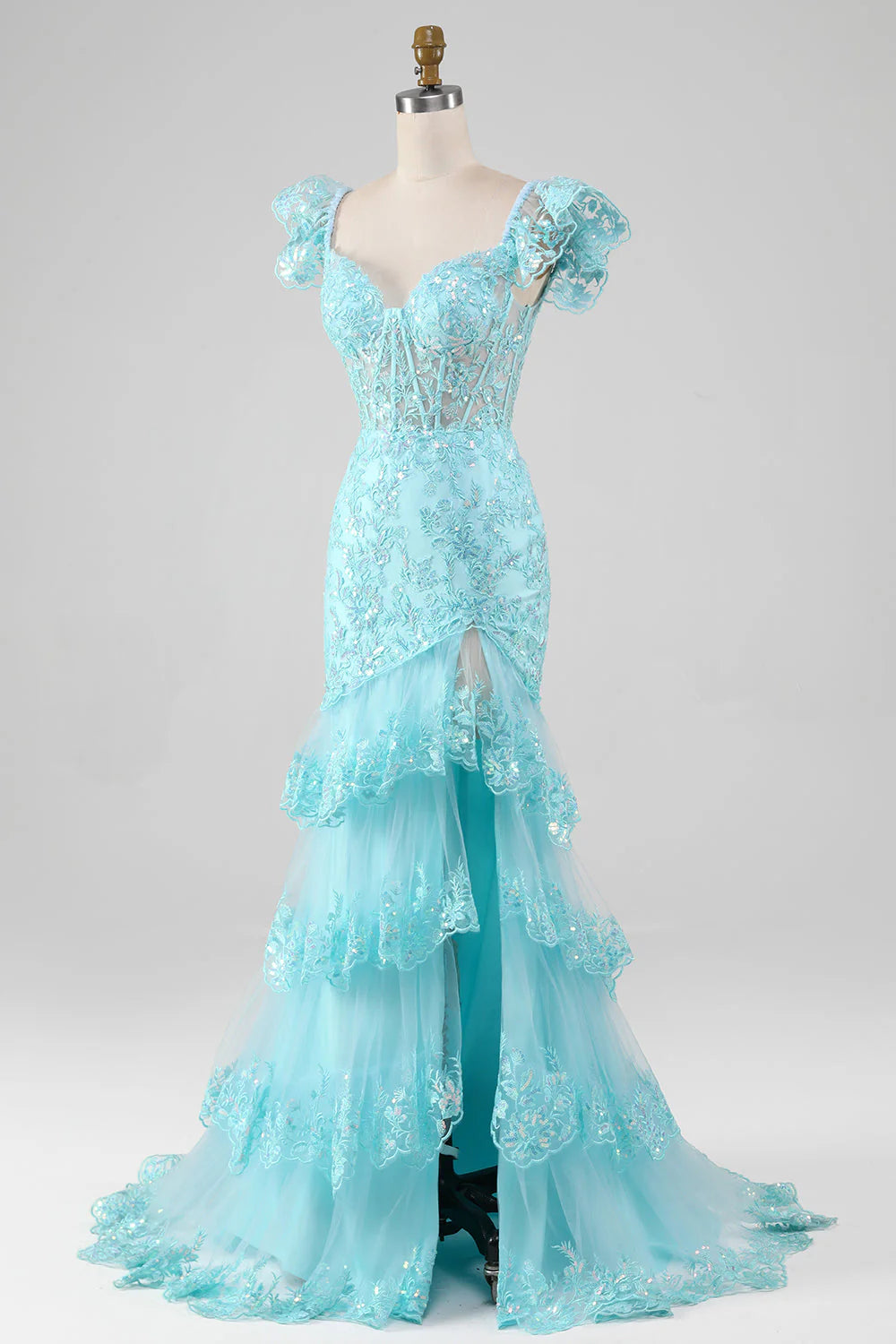 Close-up of the intricate lace and sequin details on a sky blue off-shoulder mermaid prom dress.