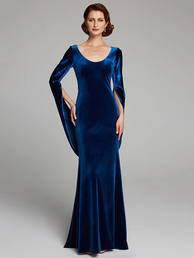 Back view of a woman in a dark velvet long sleeve dress with a sweep train.